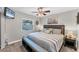 Cozy bedroom with comfortable bed, ceiling fan, and neutral decor at 1612 Shady Leaf Dr, Valrico, FL 33596