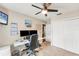 Functional office space with ceiling fan, desk, and closet for storage at 1612 Shady Leaf Dr, Valrico, FL 33596