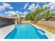 Backyard pool and spa with clear blue water, and a private fenced yard at 1612 Shady Leaf Dr, Valrico, FL 33596