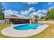 Backyard view of a private pool with screened-in patio attached to the home at 1612 Shady Leaf Dr, Valrico, FL 33596