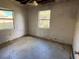 Bedroom showing damage to walls, ceiling and flooring at 1758 35Th St, Sarasota, FL 34234