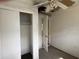 Bedroom with damaged walls, ceiling, and closet at 1758 35Th St, Sarasota, FL 34234