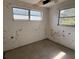 This is a bedroom with two windows, mold, and ceiling damage at 1758 35Th St, Sarasota, FL 34234