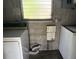 This is a laundry room with old washer and dryer at 1758 35Th St, Sarasota, FL 34234