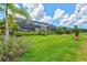 Spacious backyard with green grass and view of home at 17728 Polo Trail, Lakewood Ranch, FL 34211