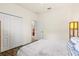 This light bedroom includes wood floors, a closet, and a view to the hall at 17728 Polo Trail, Lakewood Ranch, FL 34211