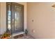 The front door has decorative glass inserts and a 'Hello' mat on the brick-paved entry at 17728 Polo Trail, Lakewood Ranch, FL 34211
