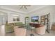 Comfortable living area featuring neutral tile flooring and a ceiling fan at 17728 Polo Trail, Lakewood Ranch, FL 34211