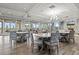 Spacious lounge featuring ample seating, hardwood floors, and large windows that provide stunning views and natural light at 17728 Polo Trail, Lakewood Ranch, FL 34211