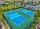 Aerial view of the community's vibrant blue pickleball courts at 17728 Polo Trail, Lakewood Ranch, FL 34211