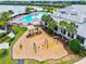 Aerial view of the community playground with nearby pool and clubhouse at 17728 Polo Trail, Lakewood Ranch, FL 34211