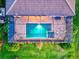 An aerial view shows a sparkling pool and screened-in patio of this home at 17728 Polo Trail, Lakewood Ranch, FL 34211