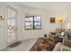 Cozy sitting area with view of lake and access to the screened in porch at 17728 Polo Trail, Lakewood Ranch, FL 34211
