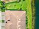 Aerial view shows a beautiful roof on a home in a community near a tranquil lake at 23528 Awabuki Dr # 101, Venice, FL 34293