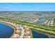 A high aerial view shows a vast community of homes surrounding several ponds at 23528 Awabuki Dr # 101, Venice, FL 34293