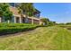 Expansive backyard with a well-manicured lawn leading to a scenic waterway, perfect for outdoor activities at 23528 Awabuki Dr # 101, Venice, FL 34293