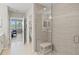 Modern bathroom featuring a glass-enclosed shower with a built-in bench and tile surround at 23528 Awabuki Dr # 101, Venice, FL 34293