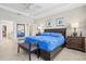 Bedroom with tray ceiling, natural light, and walk-in closet at 23528 Awabuki Dr # 101, Venice, FL 34293