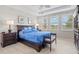 Bedroom with tray ceiling, natural light, and elegant furniture at 23528 Awabuki Dr # 101, Venice, FL 34293