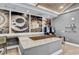 Stylish coffee bar featuring granite countertops, modern appliances, and elegant coffee-themed artwork at 23528 Awabuki Dr # 101, Venice, FL 34293