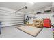 Spacious two-car garage with plenty of storage space and tools at 23528 Awabuki Dr # 101, Venice, FL 34293