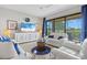Bright and airy living room features contemporary furniture and scenic outdoor views at 23528 Awabuki Dr # 101, Venice, FL 34293