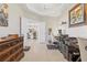 Home office featuring a desk and shelving, with view into the kitchen at 23528 Awabuki Dr # 101, Venice, FL 34293