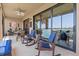 Covered outdoor patio with comfortable seating and views of the lake at 23528 Awabuki Dr # 101, Venice, FL 34293