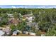 Wide aerial view showing house, other homes, and mature landscaping, set in a desirable neighborhood at 2646 Martin St, Sarasota, FL 34237