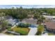 Aerial view of a charming home, showcasing its well-maintained lawn, landscaping, and fully fenced yard at 2646 Martin St, Sarasota, FL 34237