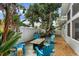 Relaxing backyard retreat with Adirondack chairs surrounding a fire pit for cozy outdoor gatherings at 2646 Martin St, Sarasota, FL 34237