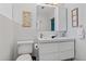 Bright bathroom features a double sink vanity with modern fixtures and a decorative mirror at 2646 Martin St, Sarasota, FL 34237