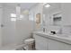 Modern bathroom featuring dual sinks, shower stall and white tile throughout at 2646 Martin St, Sarasota, FL 34237