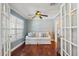 Bonus room with hardwood floors, a ceiling fan, and plenty of natural light at 2646 Martin St, Sarasota, FL 34237