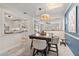 Dining area featuring a wooden table and bar stools next to kitchen and living room at 2646 Martin St, Sarasota, FL 34237