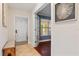 Inviting entryway with tiled floor, bench seating, and door to bonus room at 2646 Martin St, Sarasota, FL 34237