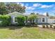 Inviting front exterior showcasing a well-manicured lawn, charming landscaping, and a bright front door at 2646 Martin St, Sarasota, FL 34237