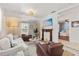 Inviting living room with a decorative fireplace, white sofa, and elegant decor at 2646 Martin St, Sarasota, FL 34237