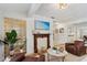 Cozy living room featuring a fireplace, glass block wall and comfortable seating at 2646 Martin St, Sarasota, FL 34237