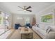 Bright living room with comfortable seating and view of bright sunroom at 2646 Martin St, Sarasota, FL 34237