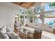 Relaxing sunroom with vaulted ceiling, ample natural light and views of the backyard at 2646 Martin St, Sarasota, FL 34237
