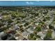 Expansive aerial view of a residential neighborhood featuring numerous single-Gathering homes and lush green spaces at 2708 27Th Avenue W Dr, Bradenton, FL 34205