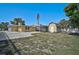 The backyard has a quaint shed and a covered carport, ideal for outdoor storage and entertainment at 2708 27Th Avenue W Dr, Bradenton, FL 34205
