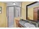 Bathroom featuring a glass-enclosed shower and vanity with sink at 2708 27Th Avenue W Dr, Bradenton, FL 34205