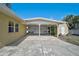 Covered carport with concrete flooring, white pillars, and exterior shed at 2708 27Th Avenue W Dr, Bradenton, FL 34205