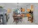 Charming dining room with a round table, wood chairs, and views of the kitchen at 2708 27Th Avenue W Dr, Bradenton, FL 34205