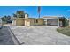 A charming home featuring a carport and cracked concrete driveway at 2708 27Th Avenue W Dr, Bradenton, FL 34205