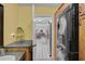 Laundry room area, featuring a washer/dryer combo, cabinetry, and view to the dining area at 2708 27Th Avenue W Dr, Bradenton, FL 34205