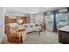 Comfortable living room with a neutral sofa, recliner, and a view through French doors at 2708 27Th Avenue W Dr, Bradenton, FL 34205