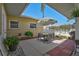Outdoor patio space with furniture, garden, white privacy fence, and view of the backyard at 2708 27Th Avenue W Dr, Bradenton, FL 34205